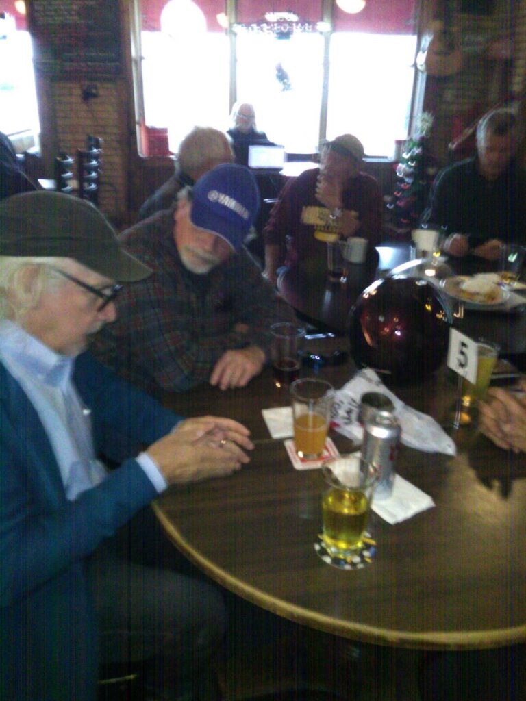 Old Guys Talking Motorcycles at a Tavern